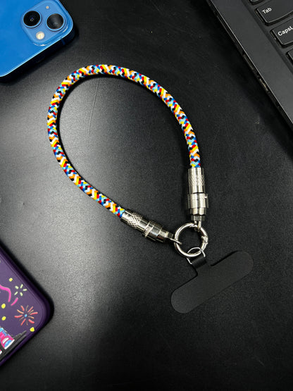 INBAE Loop lanyard cable close-up showing USB-C connector plugged into Samsung Galaxy phone charging on metro commute