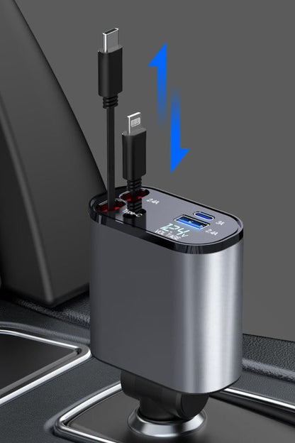 Grunx Cool Pro 4‑in‑1 car charger plugged into vehicle socket, metallic body with dual retractable cables visible, illuminated LED display showing voltage